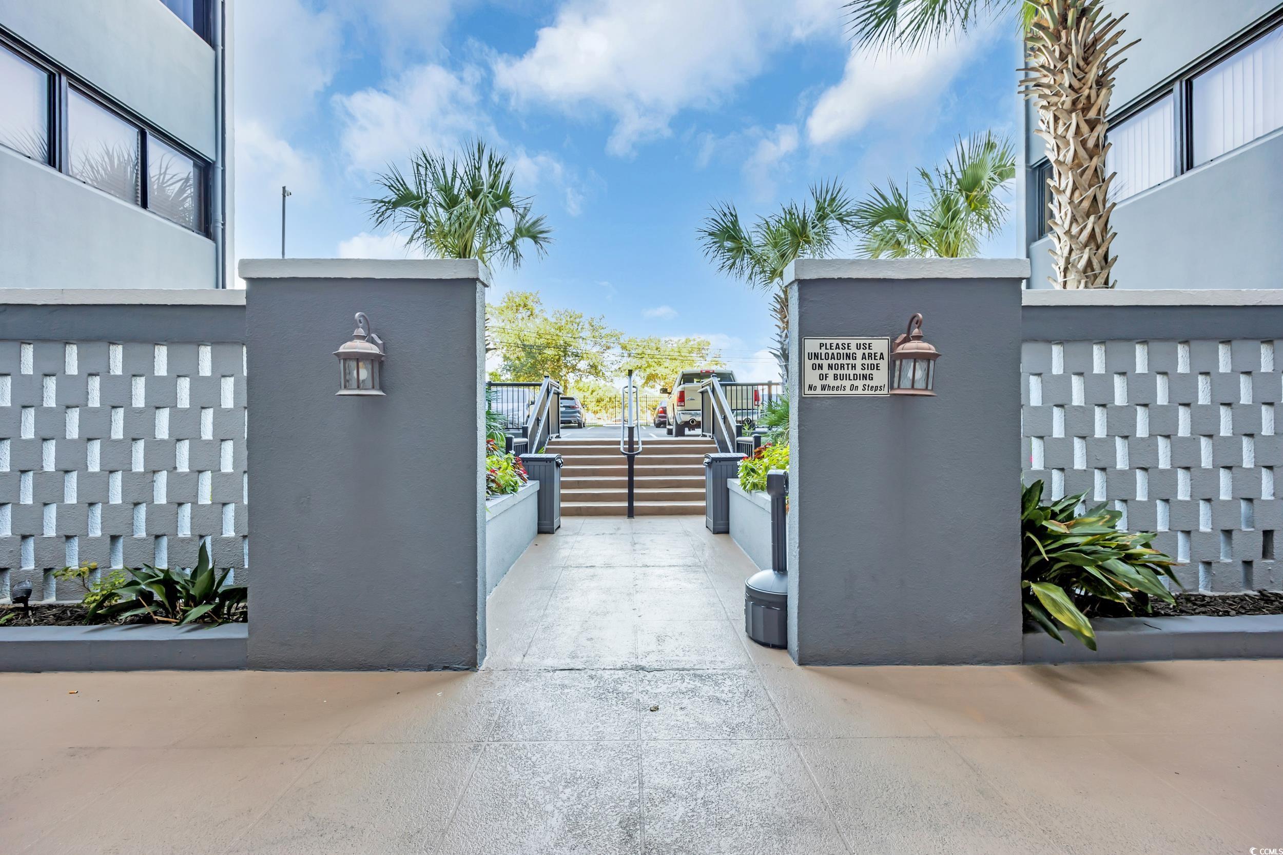 601 Mitchell Drive, Unit 203 Myrtle Beach, SC 29577 - Photo 30 of 40 View of patio with stairs