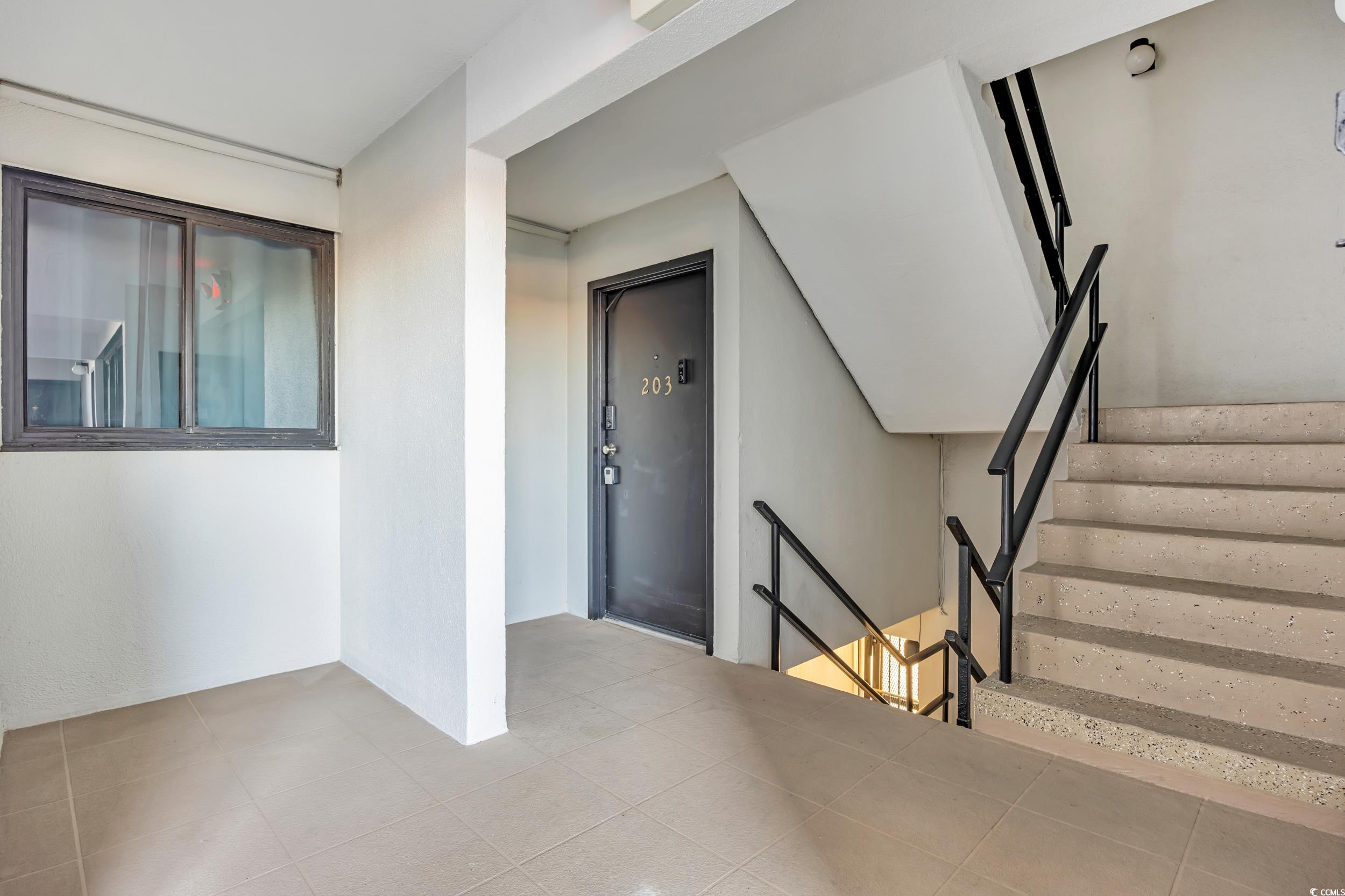 601 Mitchell Drive, Unit 203 Myrtle Beach, SC 29577 - Photo 3 of 40 Stairway featuring tile patterned flooring