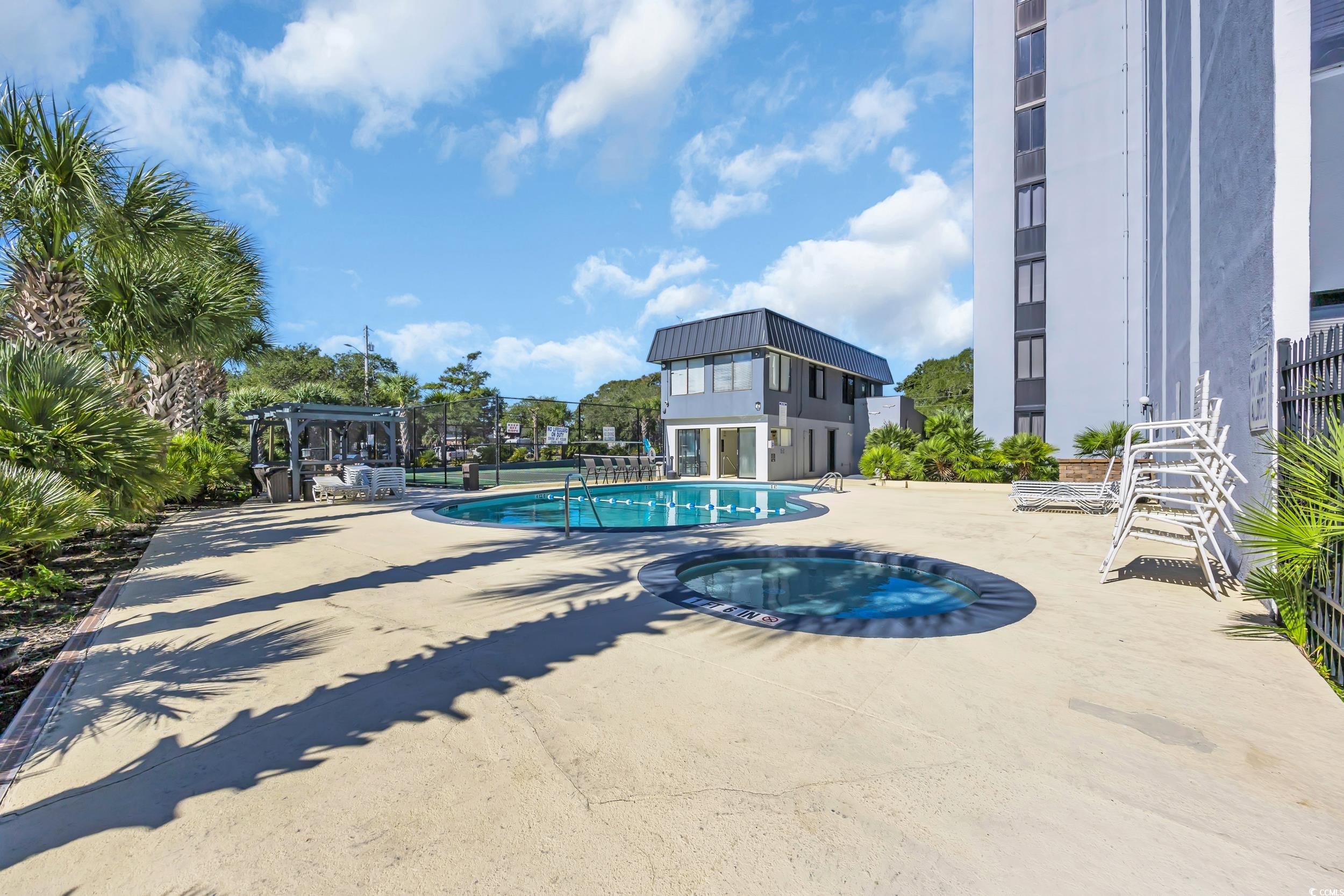 601 Mitchell Drive, Unit 203 Myrtle Beach, SC 29577 - Photo 35 of 40 Community pool with a patio and a community hot tub