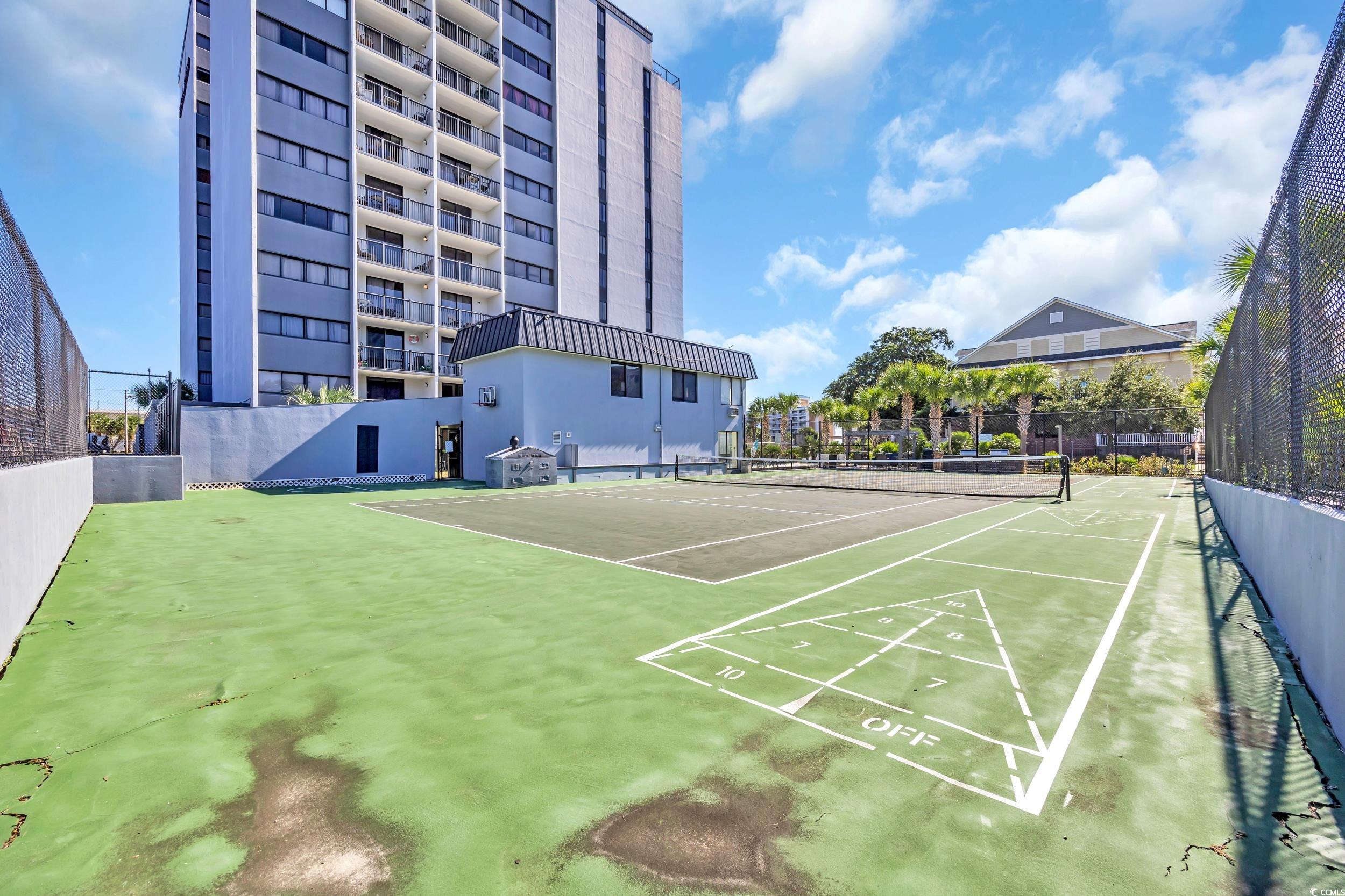 601 Mitchell Drive, Unit 203 Myrtle Beach, SC 29577 - Photo 37 of 40 Surrounding community featuring a tennis court and shuffleboard