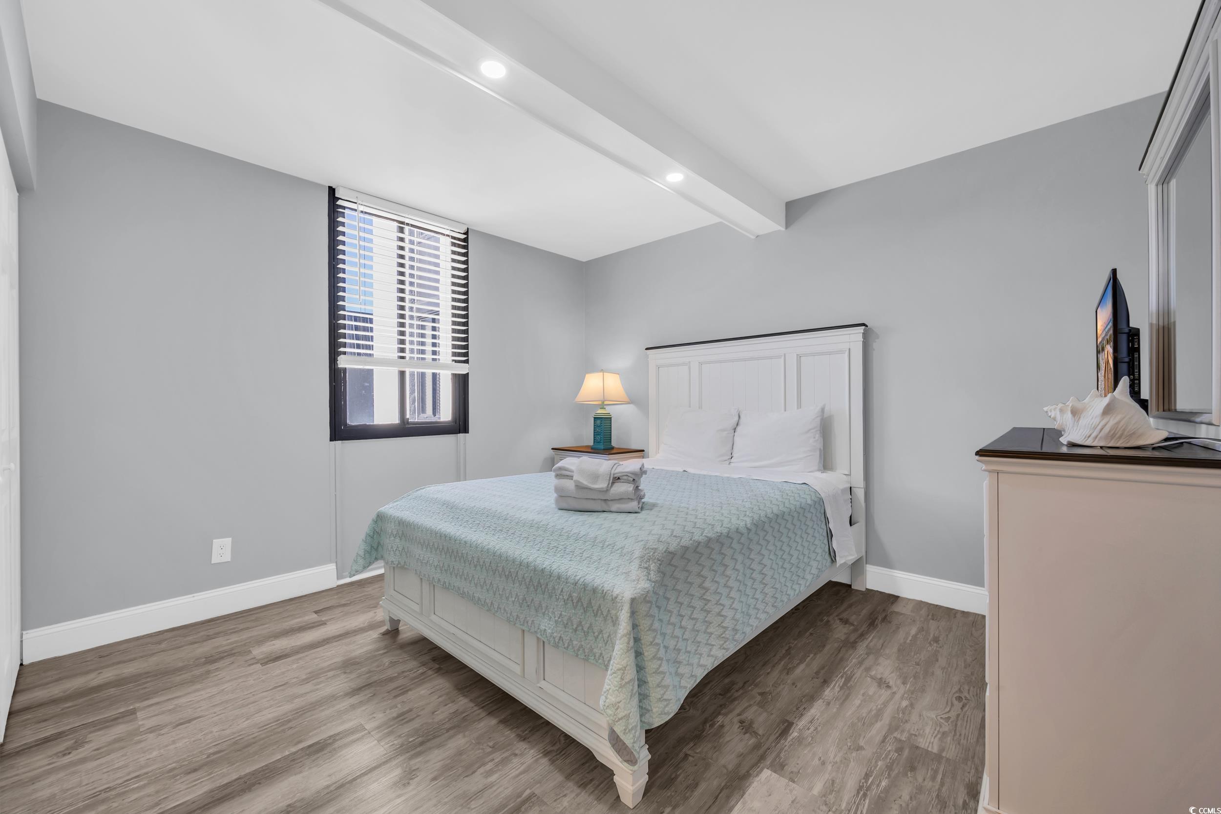 601 Mitchell Drive, Unit 203 Myrtle Beach, SC 29577 - Photo 7 of 40 Bedroom with beamed ceiling, light wood-style flooring, and recessed lighting