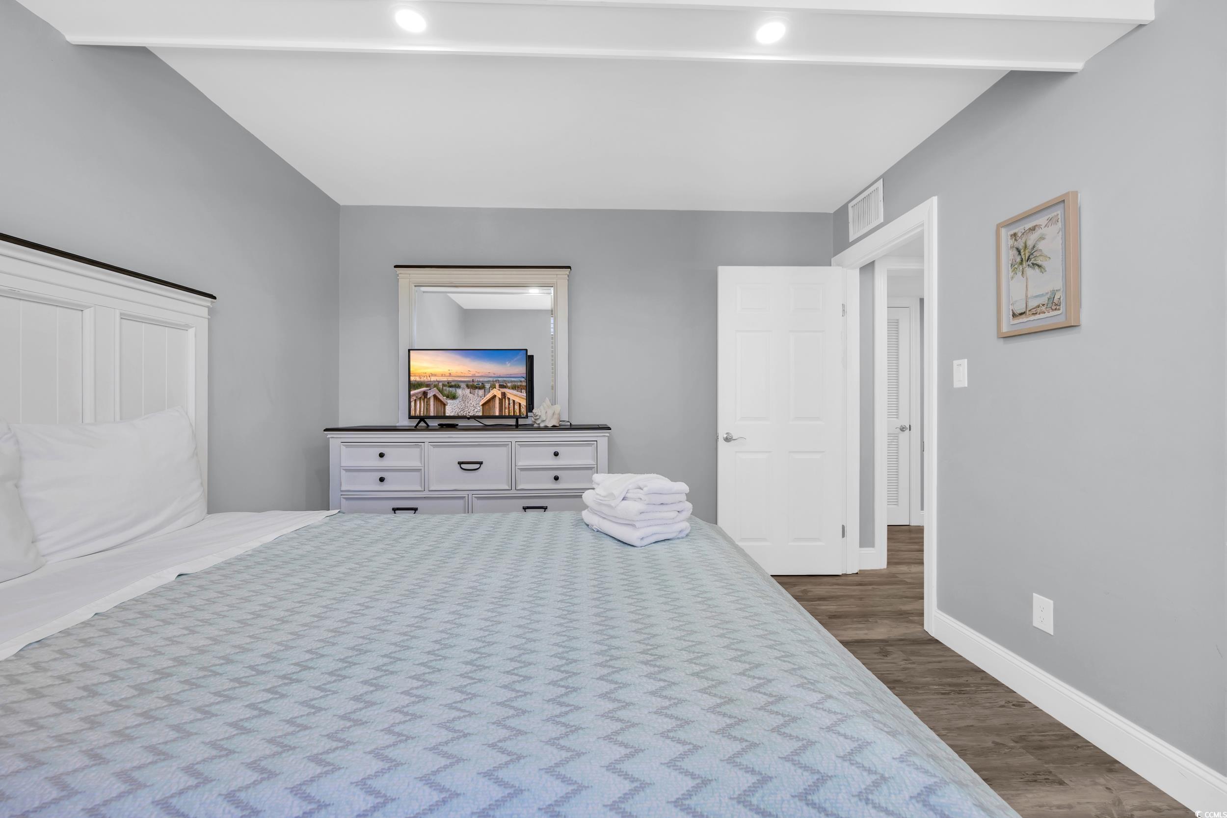 601 Mitchell Drive, Unit 203 Myrtle Beach, SC 29577 - Photo 8 of 40 Bedroom featuring wood finished floors and baseboards