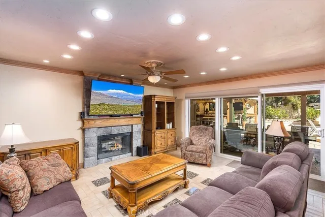 a living room with furniture fireplace and flat screen tv
