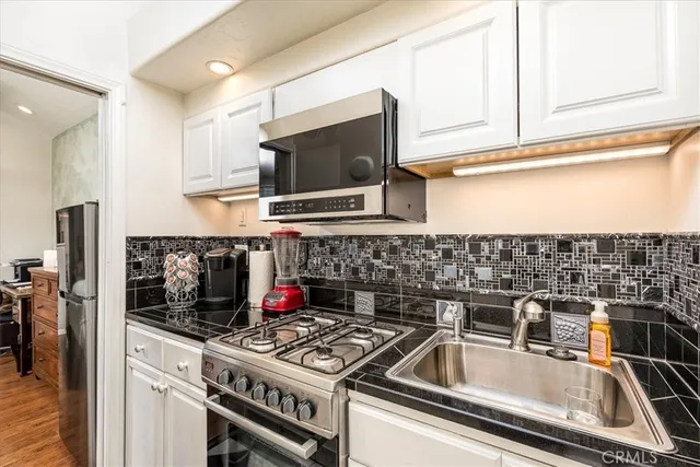 a kitchen with a stove and a microwave