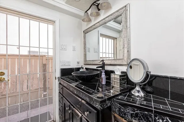 a close view of a stove in front of a bathroom