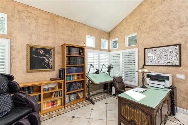 a bedroom with furniture and a window