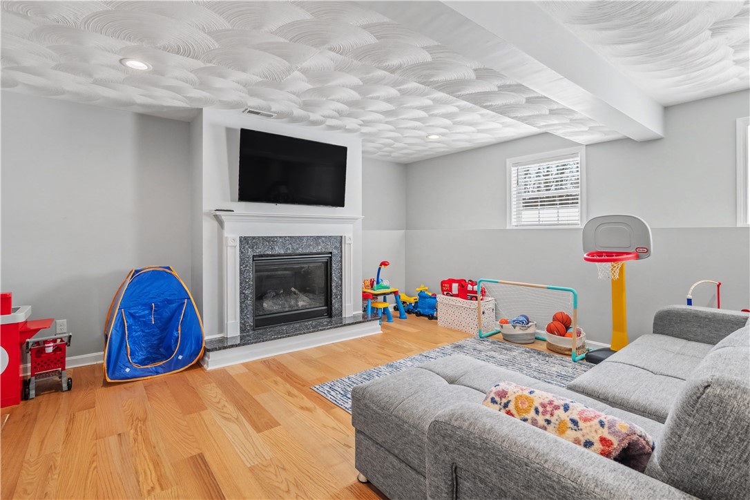 100 Franklin Road Scituate, RI 02825 - Photo 31 of 37 Rec Room with gas FP / Playroom