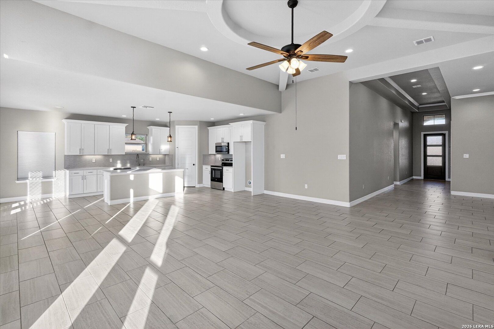 132 West Medium Meadow Drive Lytle, TX 78052 - Photo 12 of 40 a view of a kitchen with a sink and a refrigerator