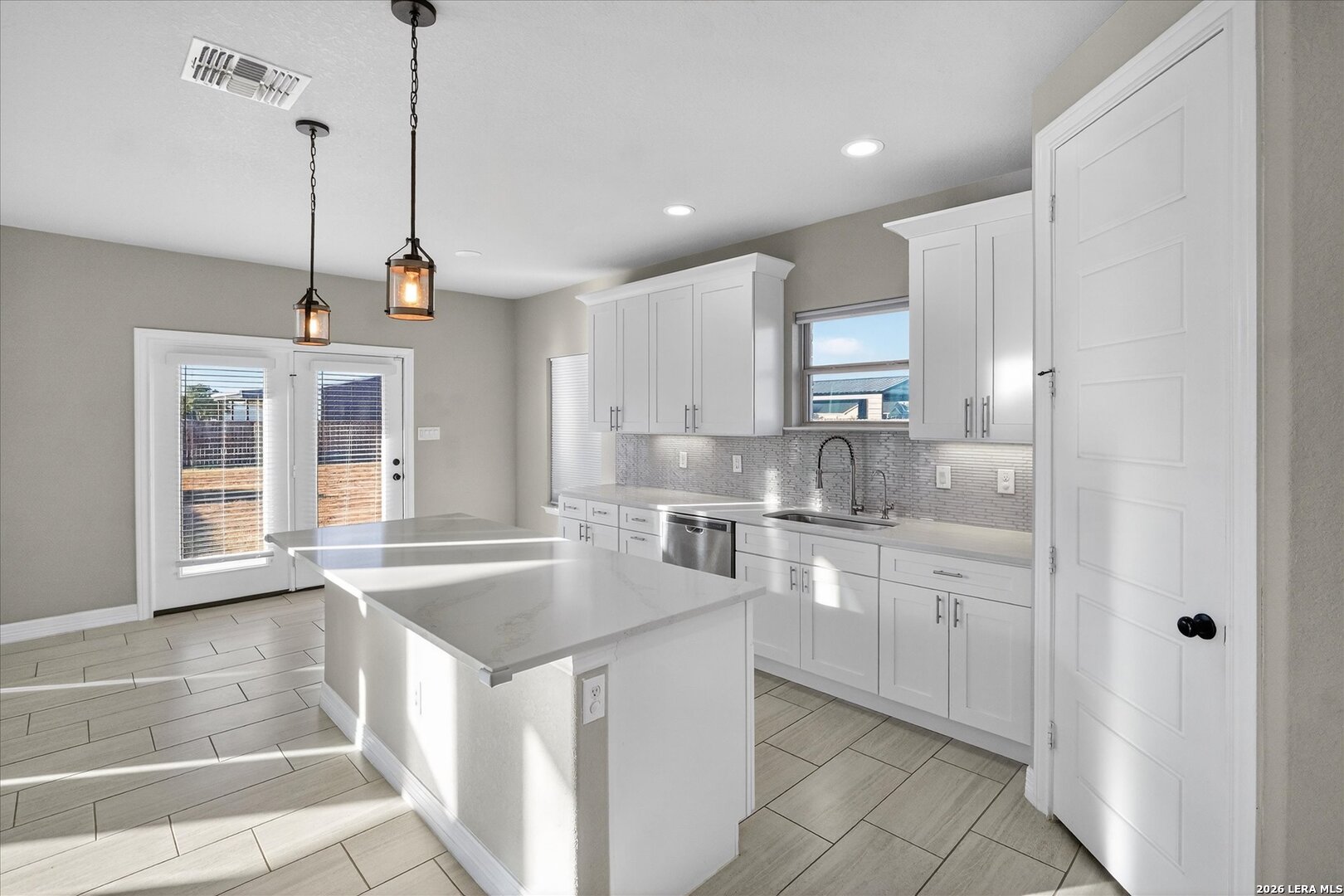 132 West Medium Meadow Drive Lytle, TX 78052 - Photo 15 of 40 a kitchen with stainless steel appliances granite countertop a sink and dishwasher