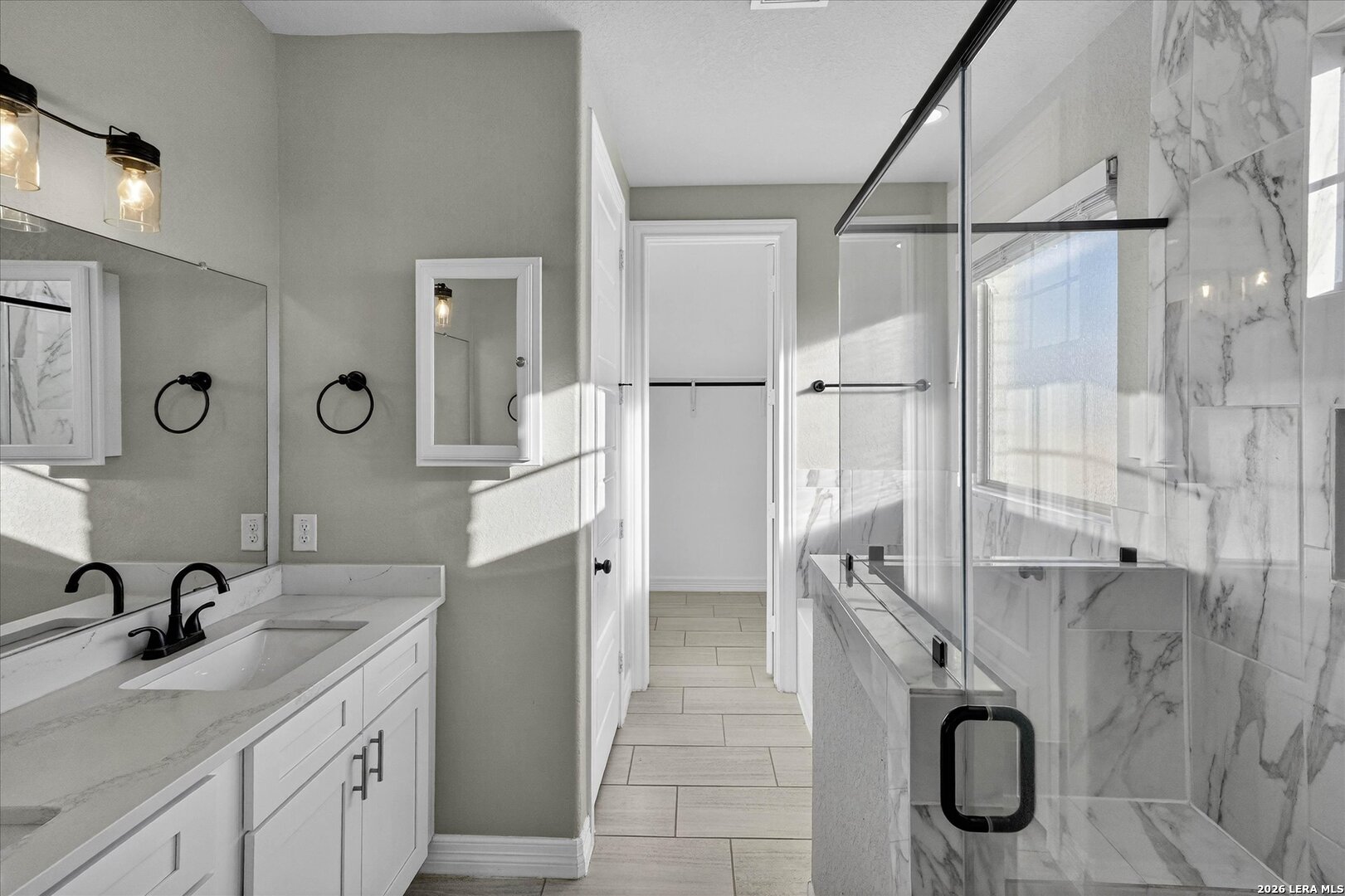 132 West Medium Meadow Drive Lytle, TX 78052 - Photo 18 of 40 a bathroom with a granite countertop sink a mirror and shower