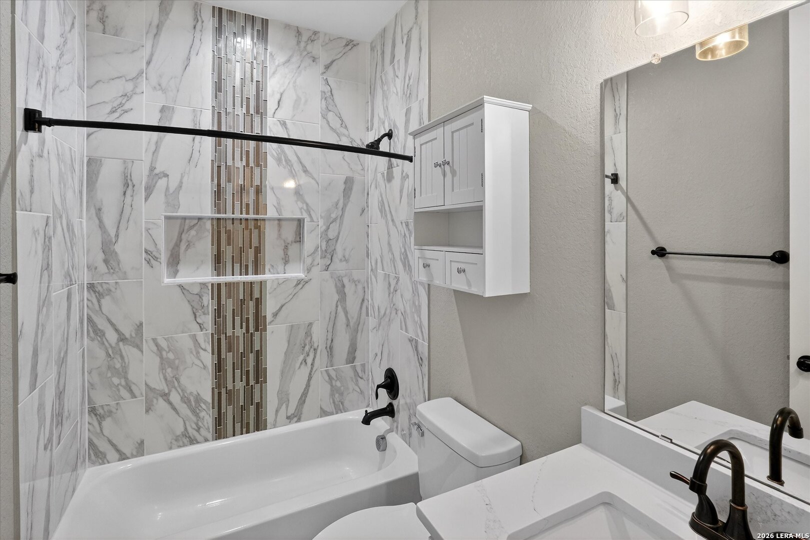 132 West Medium Meadow Drive Lytle, TX 78052 - Photo 21 of 40 a bathroom with a sink and a shower