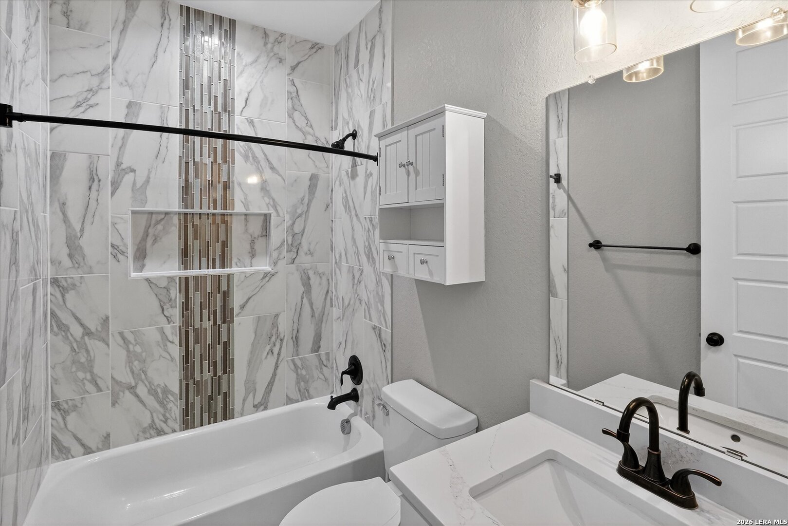 132 West Medium Meadow Drive Lytle, TX 78052 - Photo 22 of 40 a bathroom with a sink and a tub