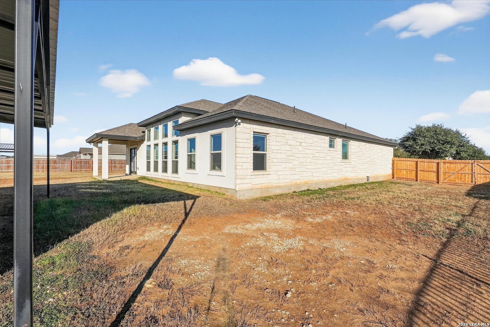 132 West Medium Meadow Drive Lytle, TX 78052 - Photo 34 of 40 a view of a house with a yard