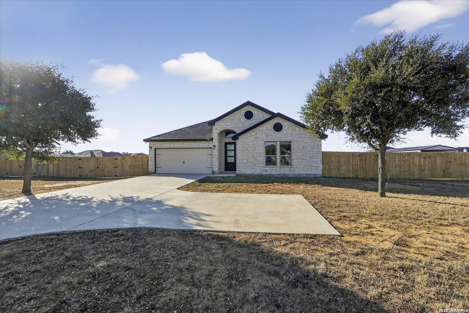 132 West Medium Meadow Drive Lytle, TX 78052 - Photo 4 of 40 a house view with a backyard space