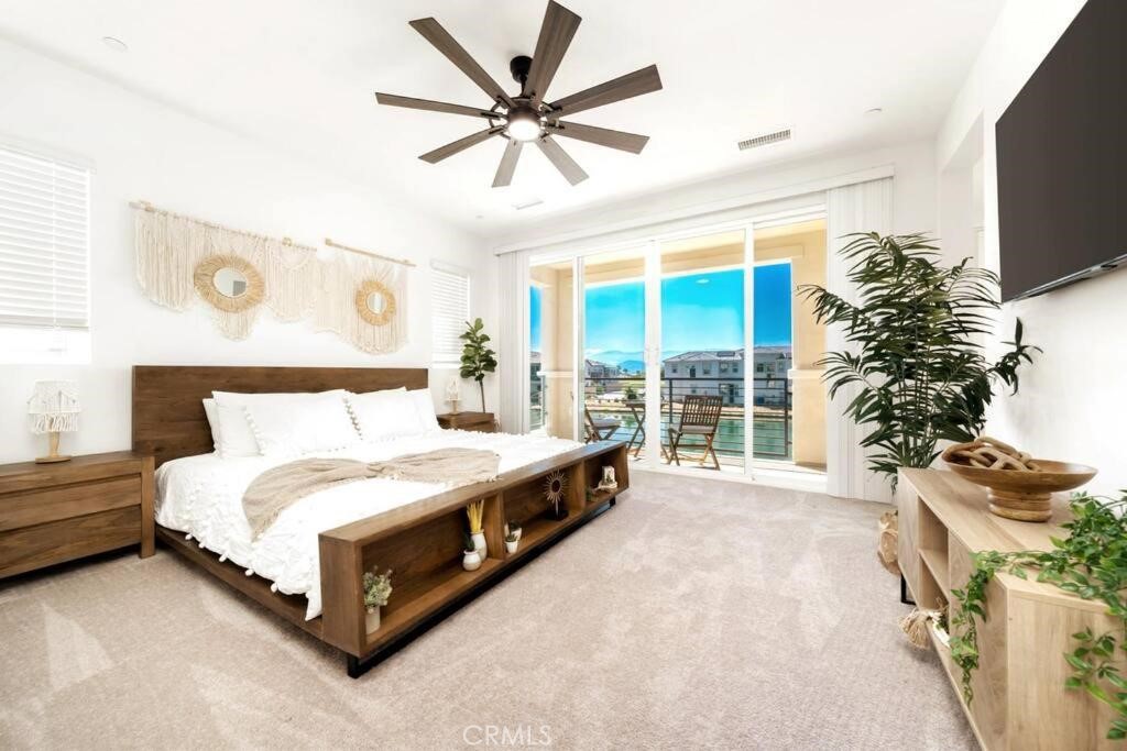 84675 Lago Brezza Indio, CA 92203 - Photo 18 of 40 a spacious bedroom with a bed and a large window