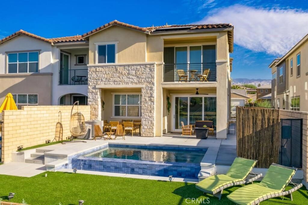 84675 Lago Brezza Indio, CA 92203 - Photo 29 of 40 a front view of a house with garden