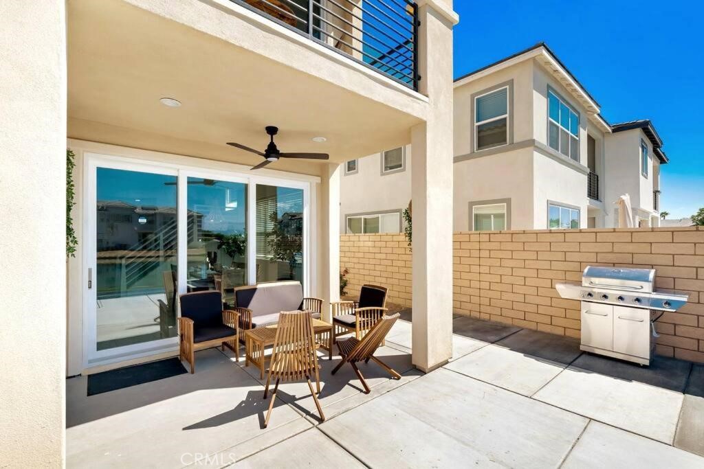 84675 Lago Brezza Indio, CA 92203 - Photo 31 of 40 a building outdoor space with patio furniture and potted plants