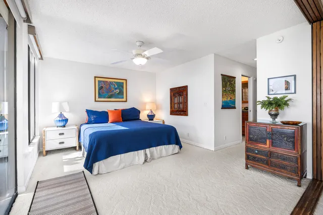 a bedroom with a bed and dresser