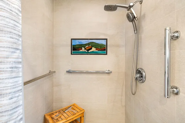 a bathroom with a shower and a shower