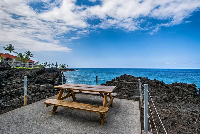 a view of a roof deck with ocean view