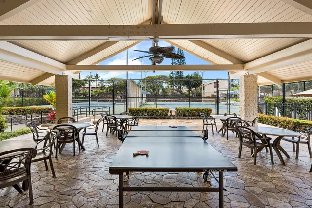 a view of a dining room with furniture and window