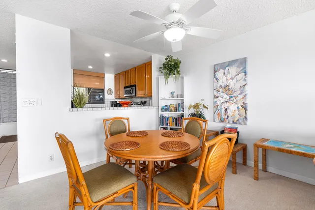 a dining room with furniture and window
