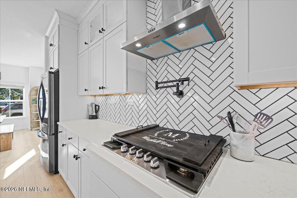 92 Patina Place St. Augustine, FL 32092 - Photo 6 of 26 a kitchen with a stove and a refrigerator