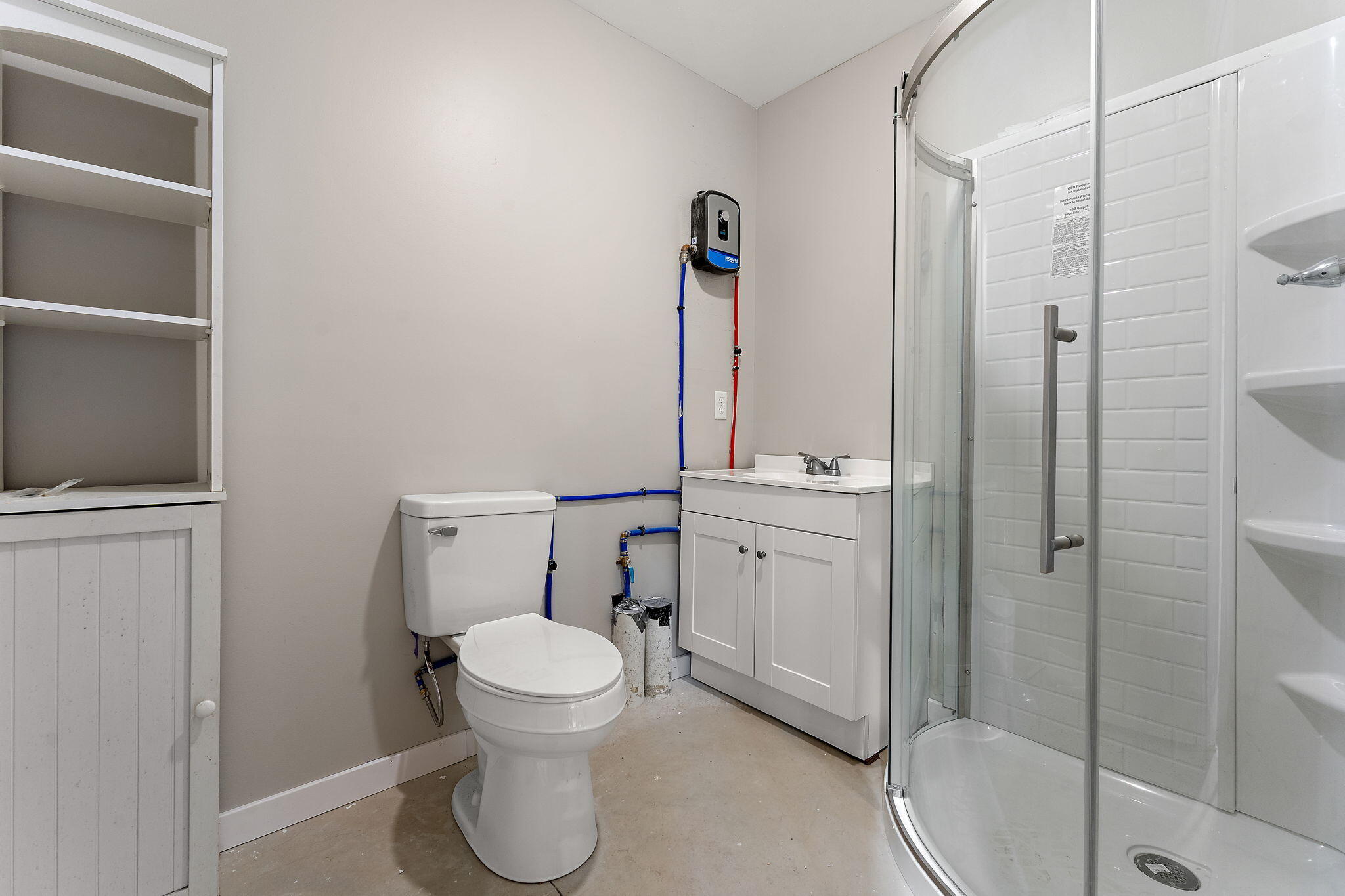 5590 East Maple Street Knox, IN 46534 - Photo 22 of 32 a bathroom with a toilet sink and a shower
