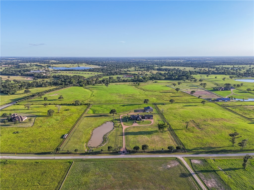 30163 High Spirit Ranch Road Hempstead, TX 77445 - Photo 2 of 49 Overview of rural landscape featuring a large body of water