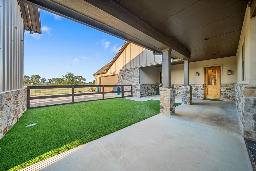 30163 High Spirit Ranch Road Hempstead, TX 77445 - Photo 41 of 49 Fenced backyard with a patio