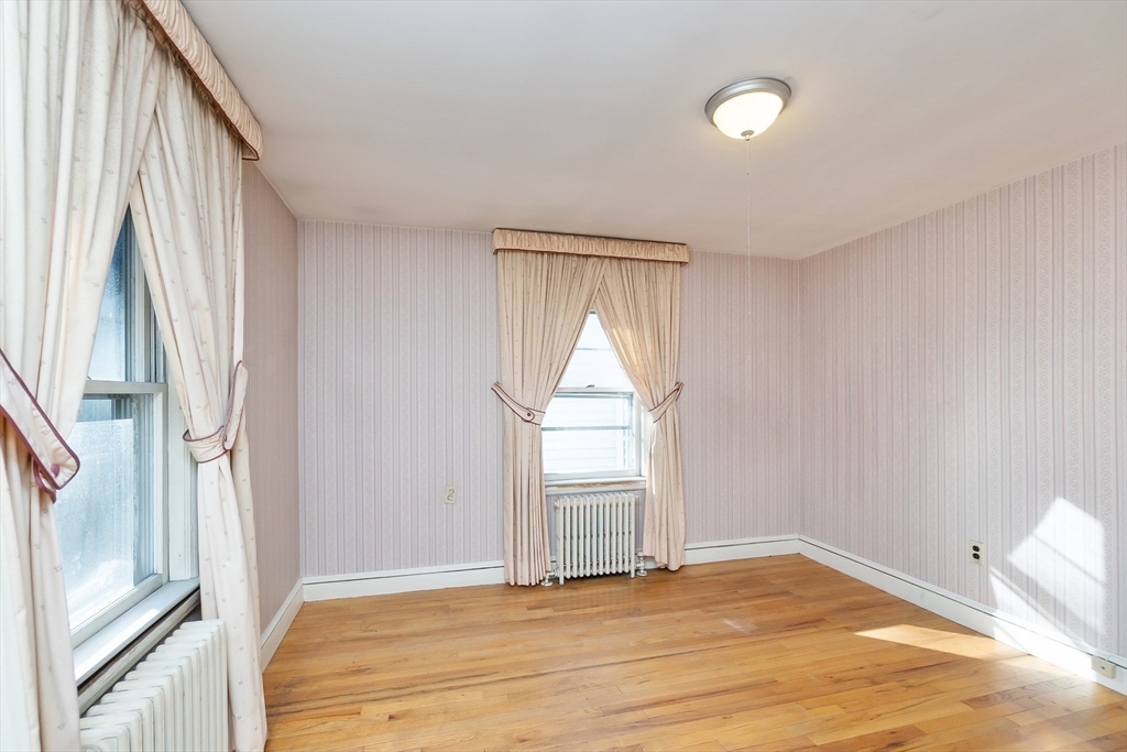 20 Rosedale Road Watertown, MA 02472 - Photo 11 of 21 a view of empty room with wooden floor and fan