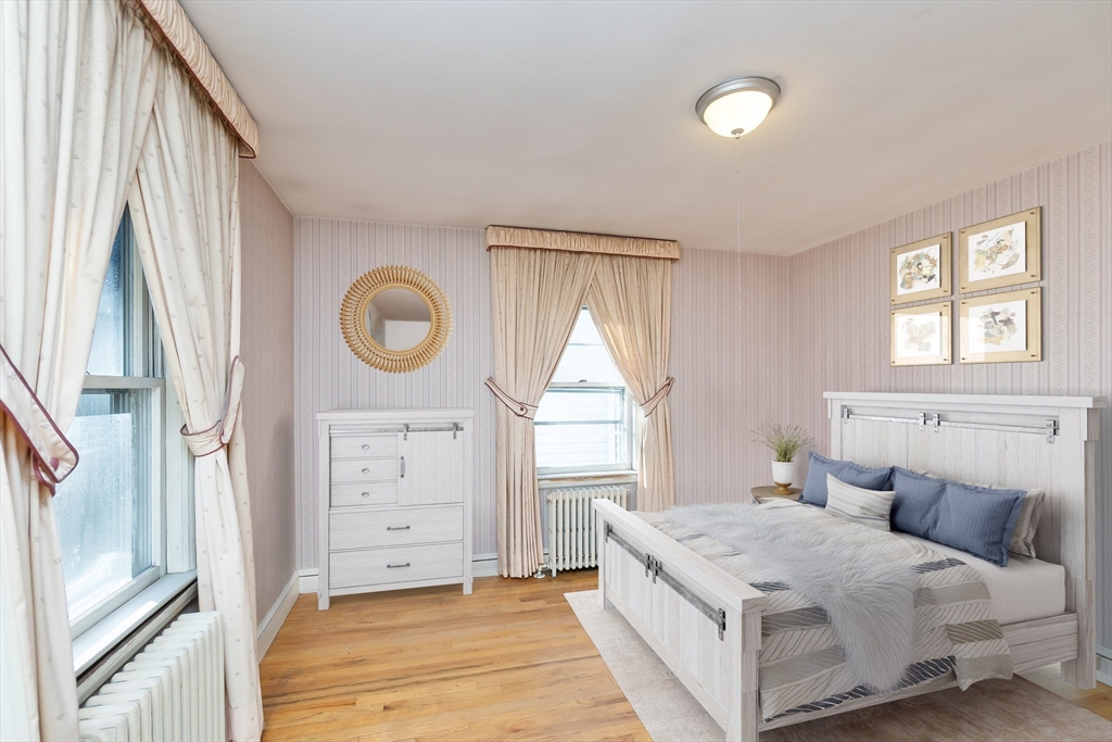 20 Rosedale Road Watertown, MA 02472 - Photo 10 of 21 a bedroom with a bed and a window