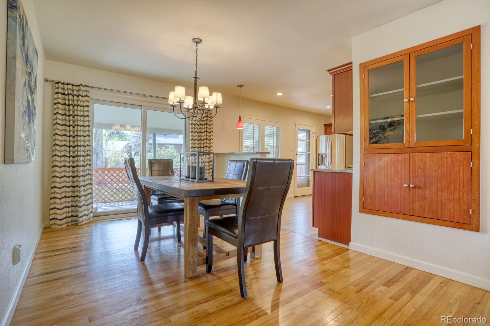 1465 South Vancouver Court Lakewood, CO 80228 - Photo 8 of 31 a view of a dining room with furniture and window