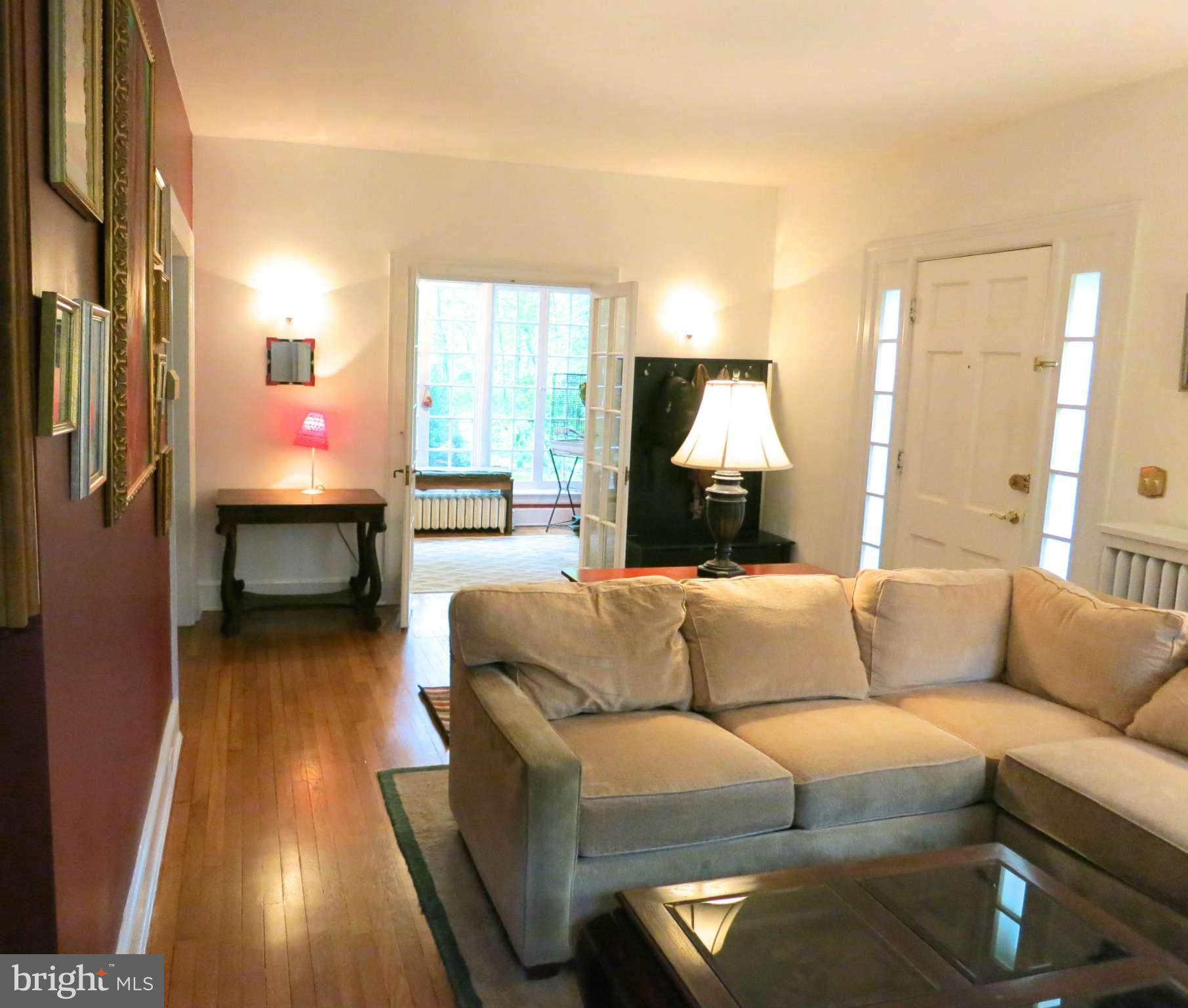 4653 Briarclift Road Baltimore, MD 21229 - Photo 3 of 30 Living Room looking into the Sunroom
