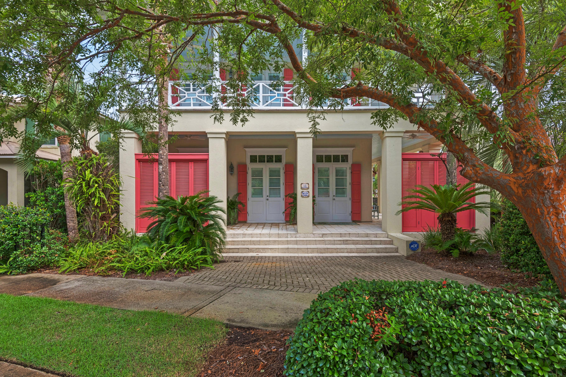 12 Place De La Fontaine Miramar Beach, FL 32550 - Photo 1 of 59 a view of a house with potted plants and a large tree
