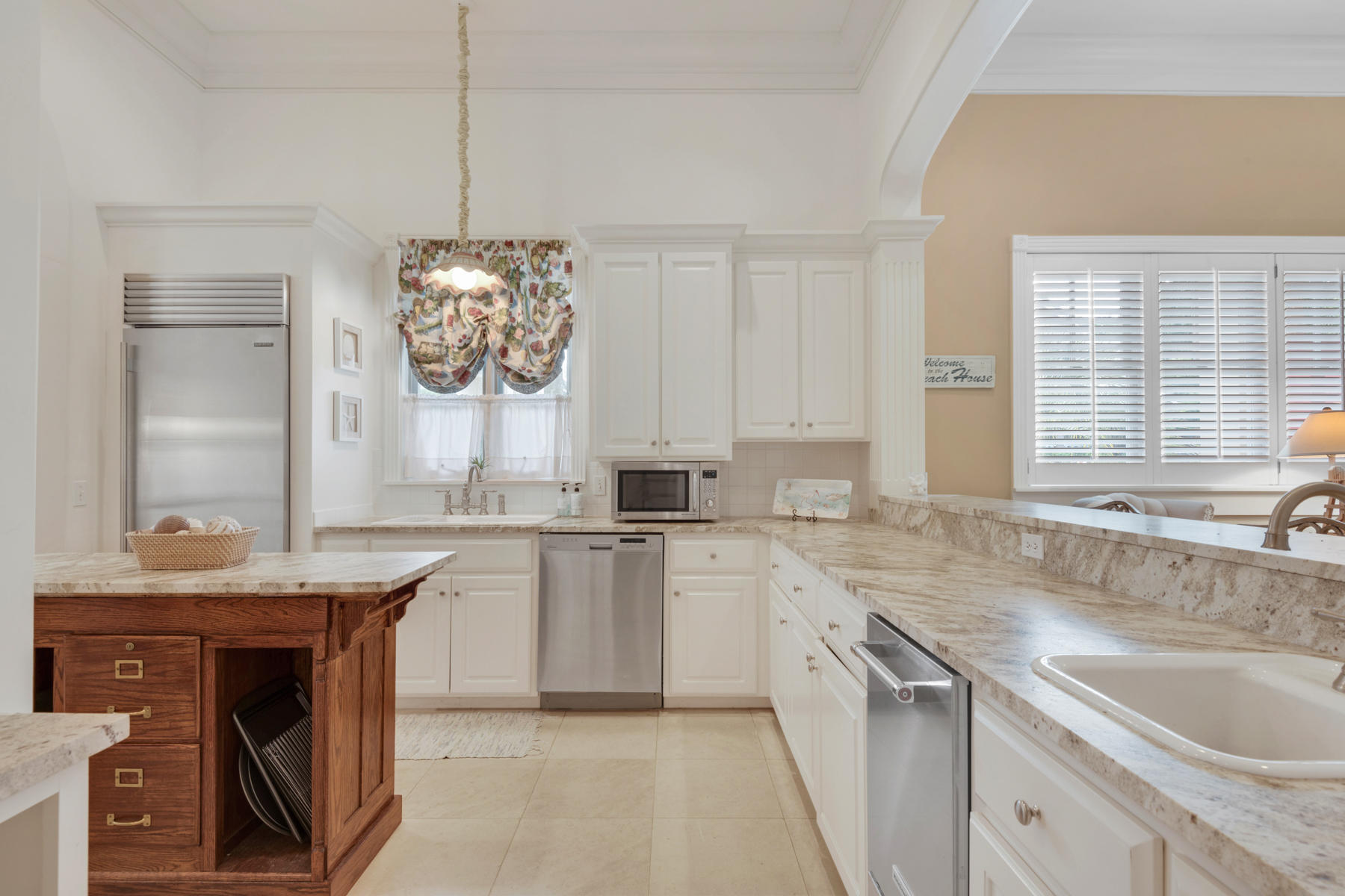 12 Place De La Fontaine Miramar Beach, FL 32550 - Photo 18 of 59 a kitchen with a sink stove and cabinets