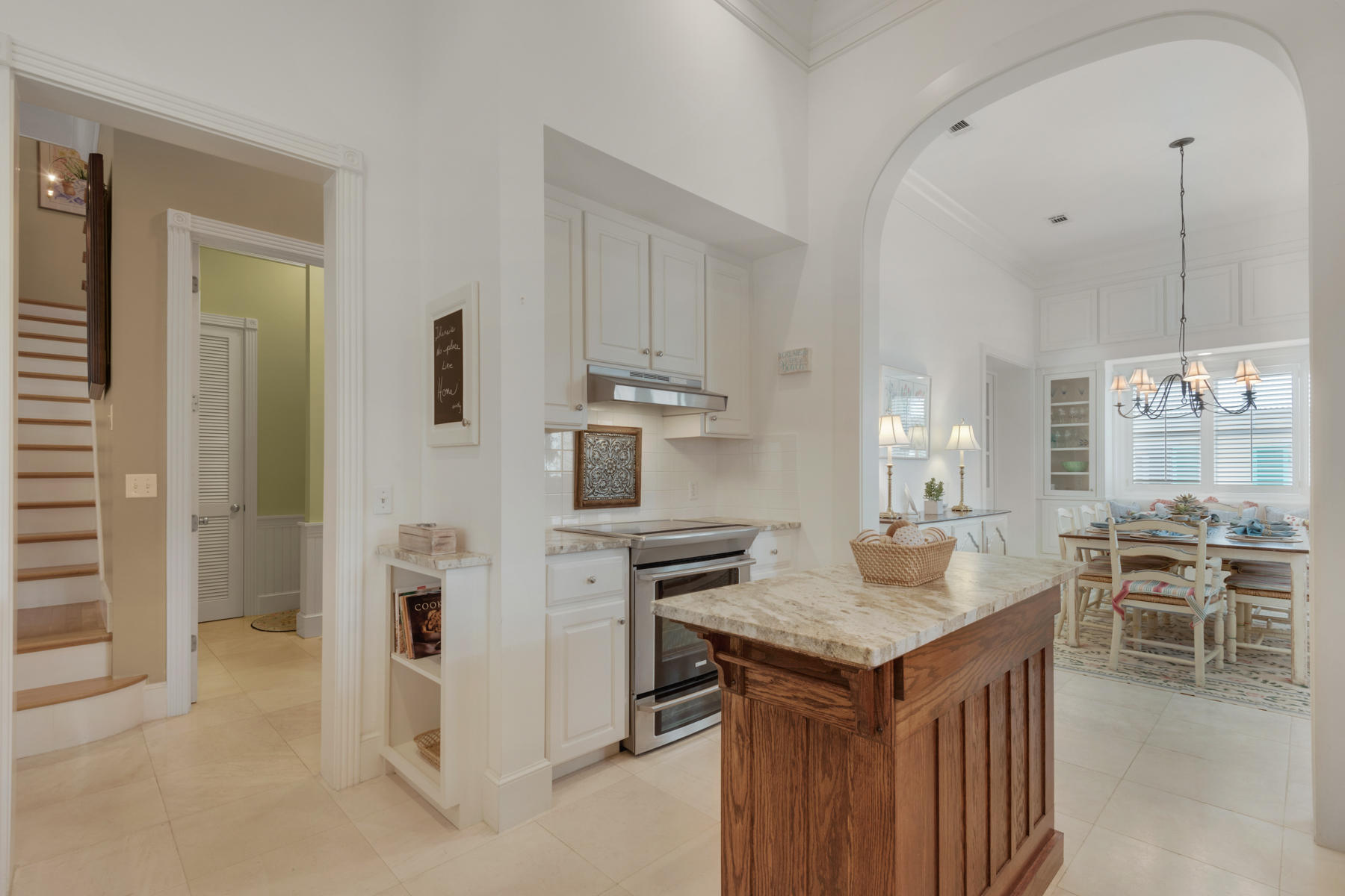 12 Place De La Fontaine Miramar Beach, FL 32550 - Photo 19 of 59 a kitchen that has a lot of cabinets in it and wooden floors