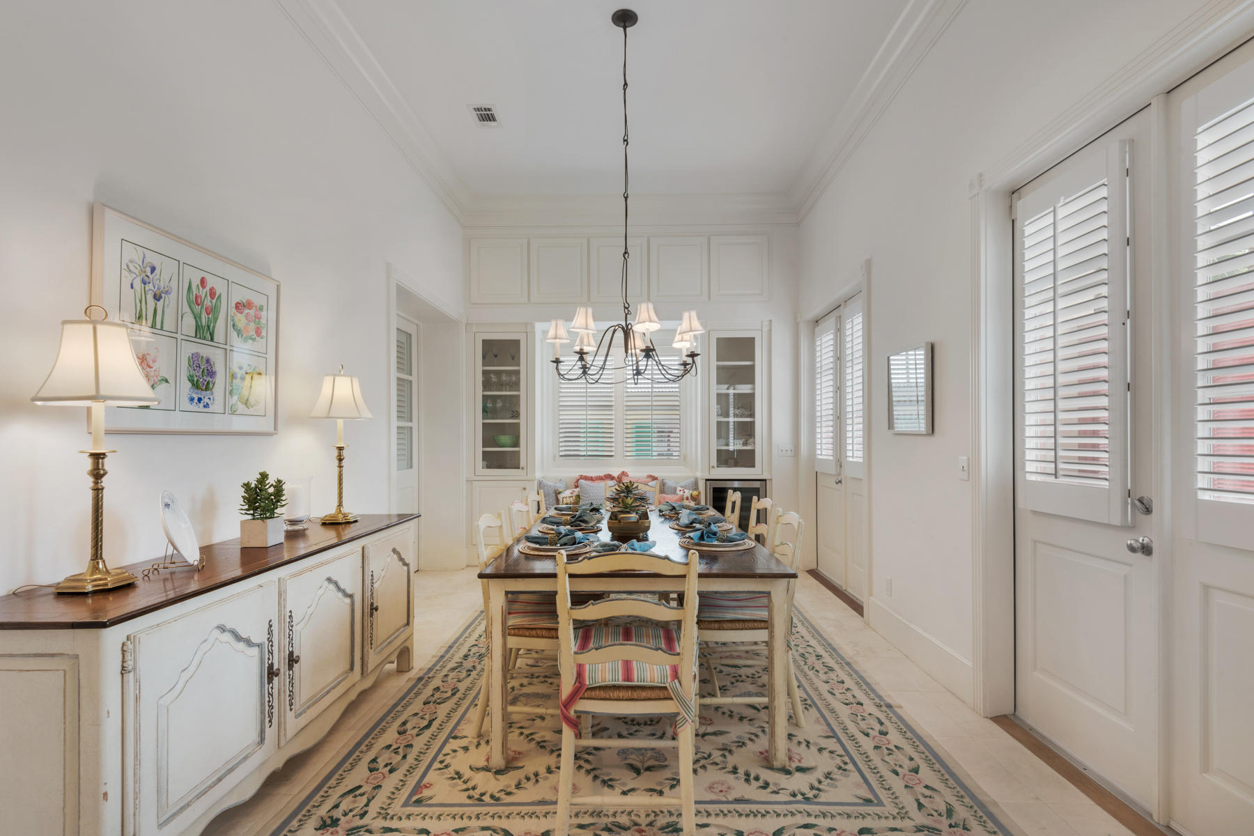 12 Place De La Fontaine Miramar Beach, FL 32550 - Photo 21 of 59 a dining room with furniture a chandelier and wooden floor