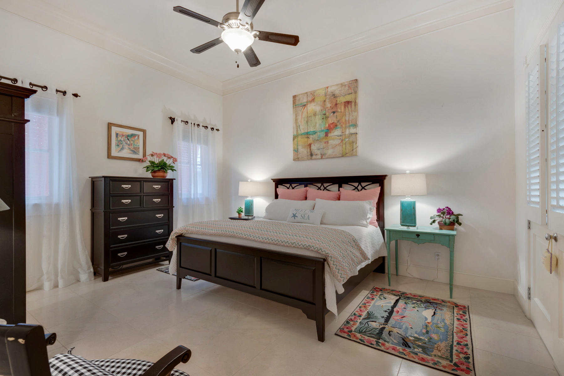 12 Place De La Fontaine Miramar Beach, FL 32550 - Photo 27 of 59 a bedroom with a bed and a chandelier