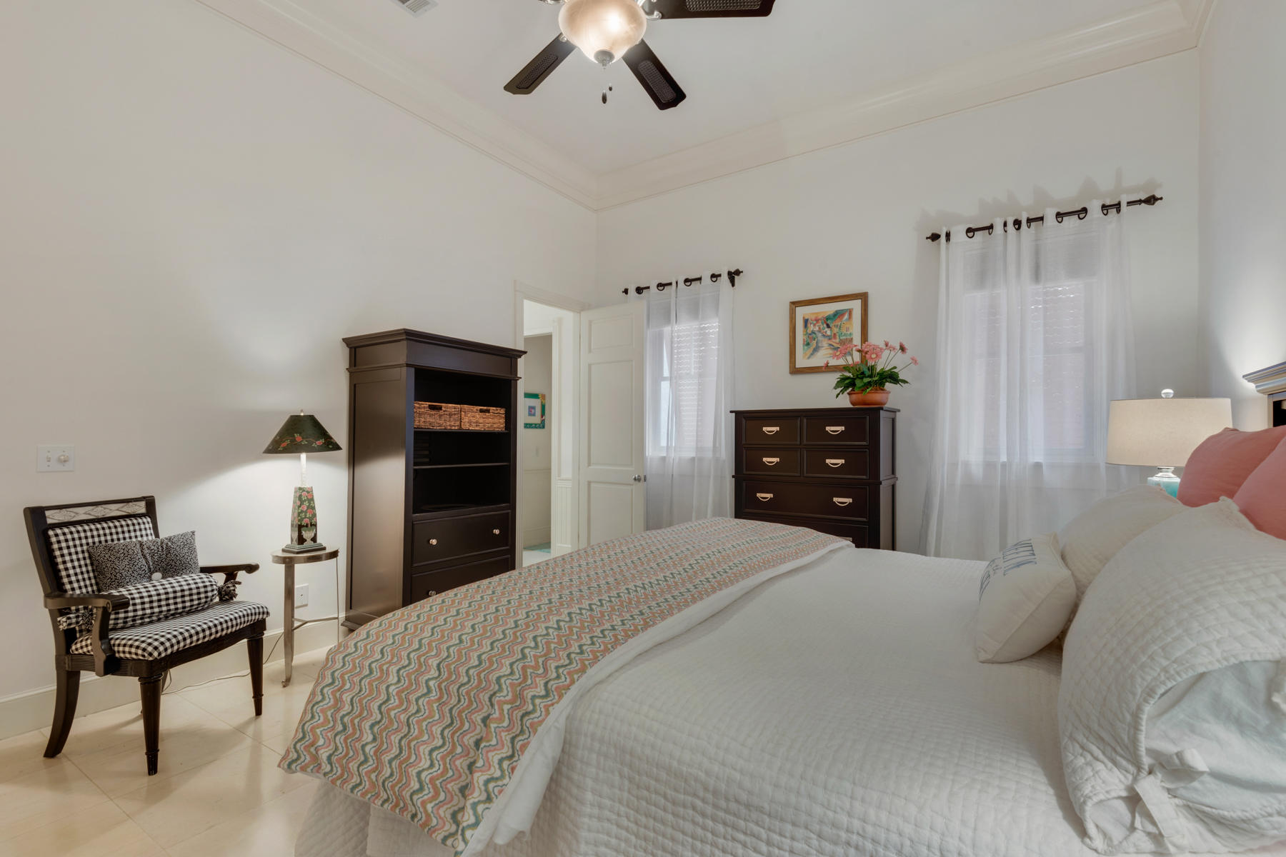 12 Place De La Fontaine Miramar Beach, FL 32550 - Photo 28 of 59 a bedroom with a bed and a chair