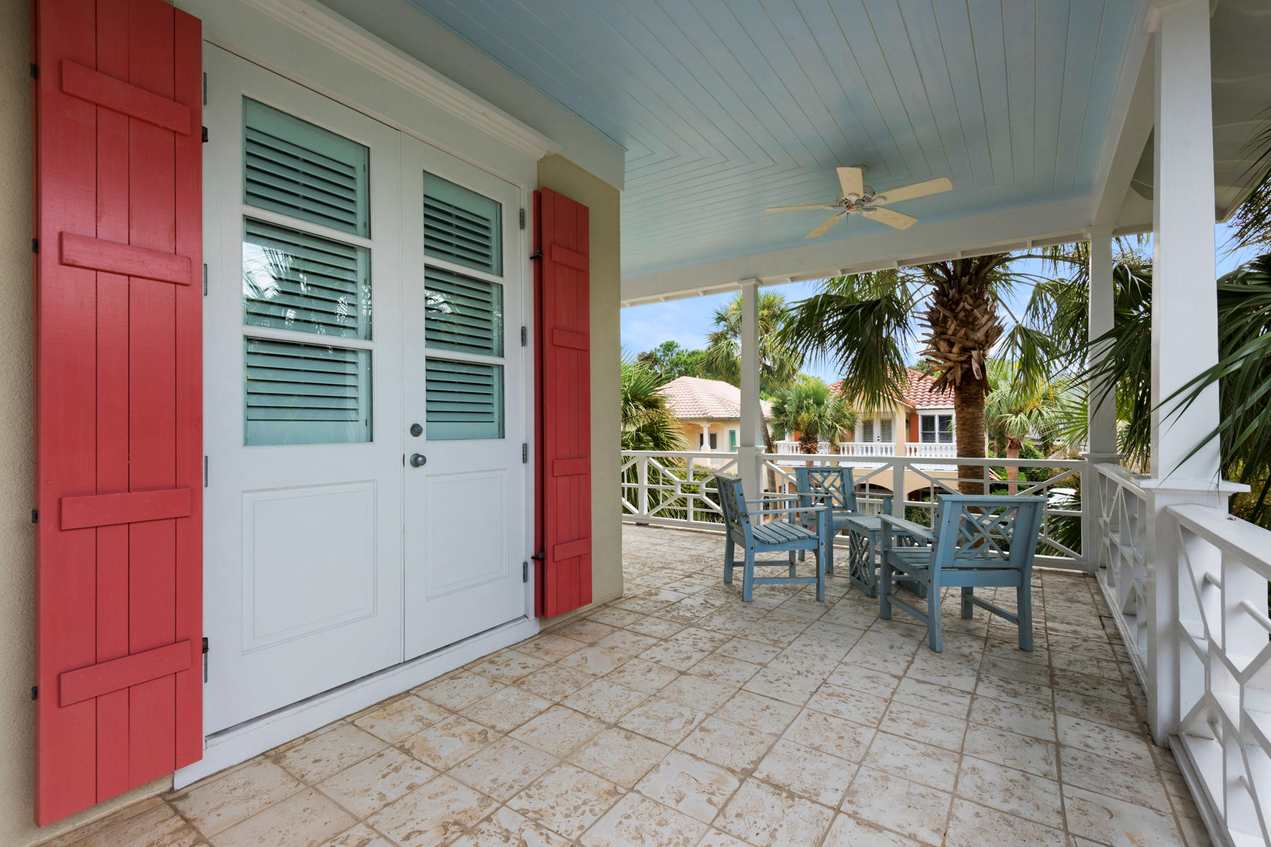 12 Place De La Fontaine Miramar Beach, FL 32550 - Photo 57 of 59 a view of a patio with dining table and chairs with the porch