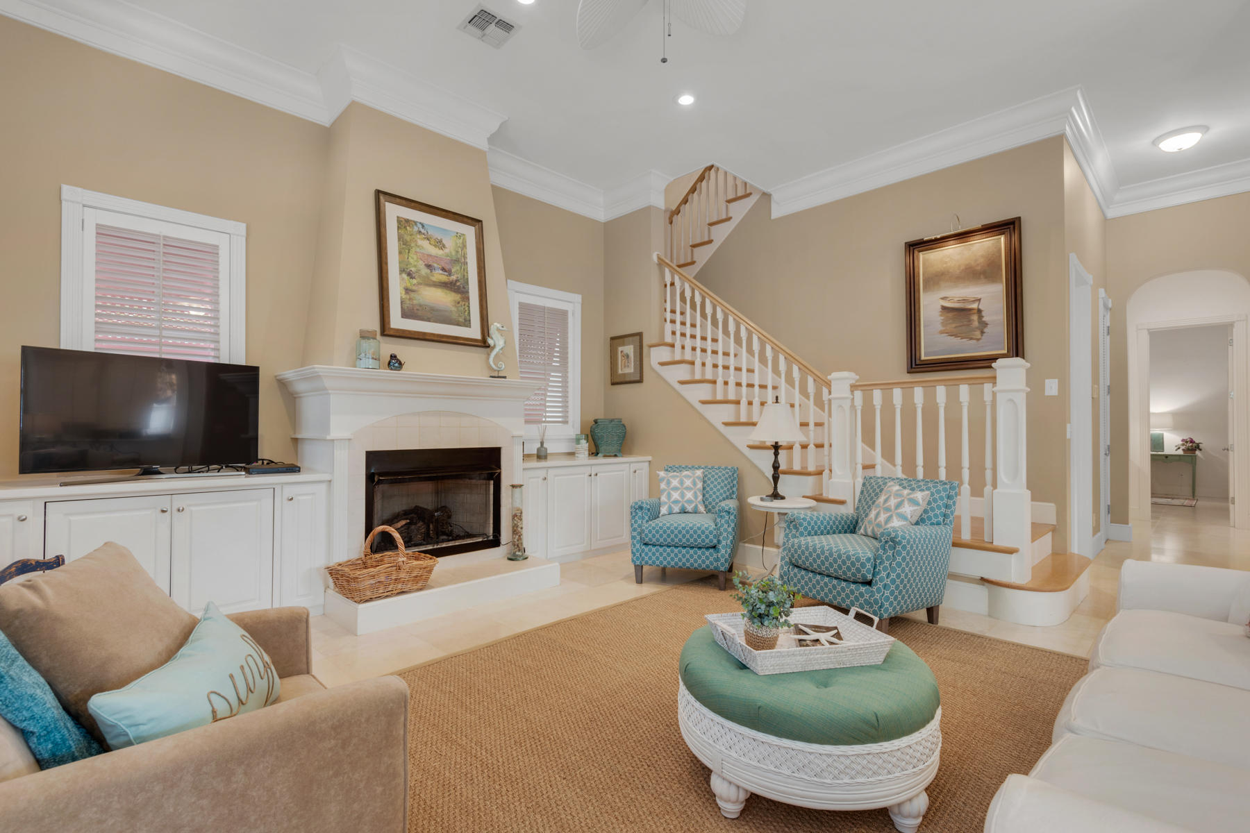 12 Place De La Fontaine Miramar Beach, FL 32550 - Photo 10 of 59 a living room with furniture a flat screen tv and a fireplace