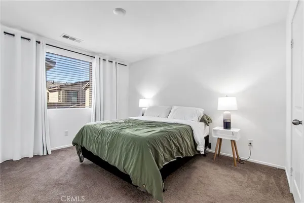 a bedroom with a bed and a walk in closet