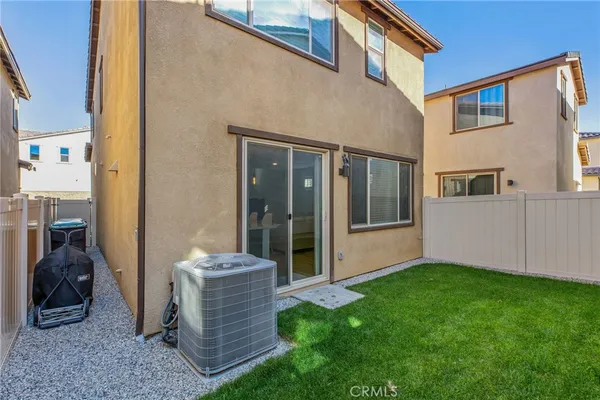 a front view of a house with a garden and yard