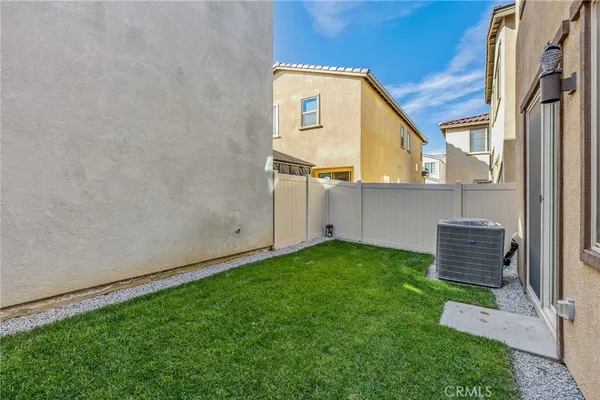 a view of a backyard with a garden and plants