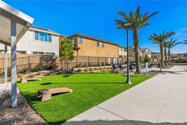a view of swimming pool with outdoor seating and a patio