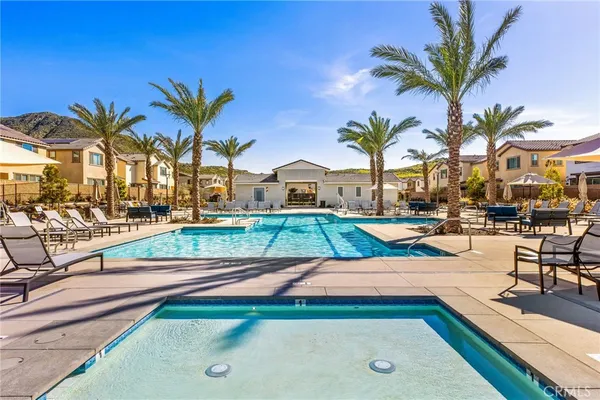 a view of a chairs and table in patio