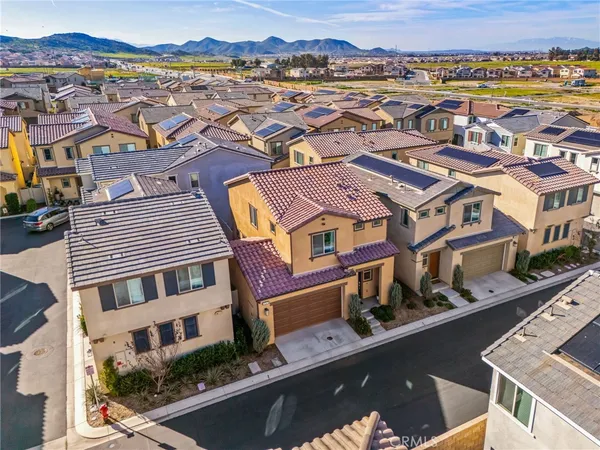 an aerial view of a residential apartment building with an outdoor space