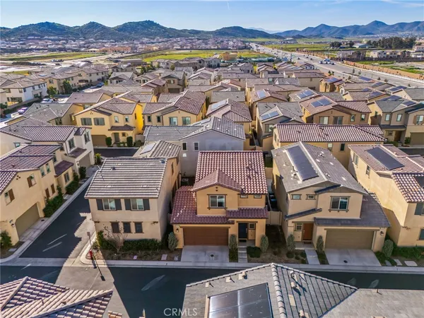 an aerial view of a residential apartment building with a city view