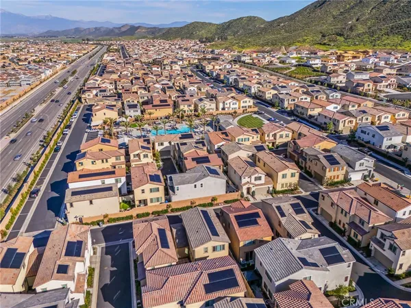 an aerial view of residential houses with outdoor space